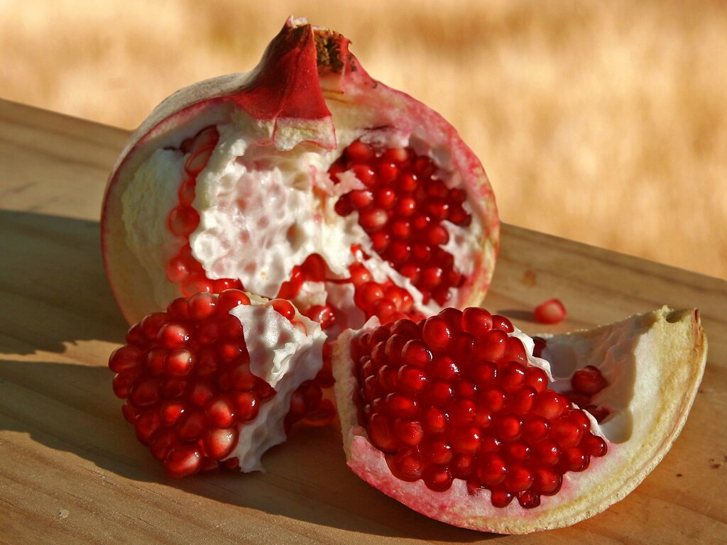 Pomegranate fruit opened up on a table